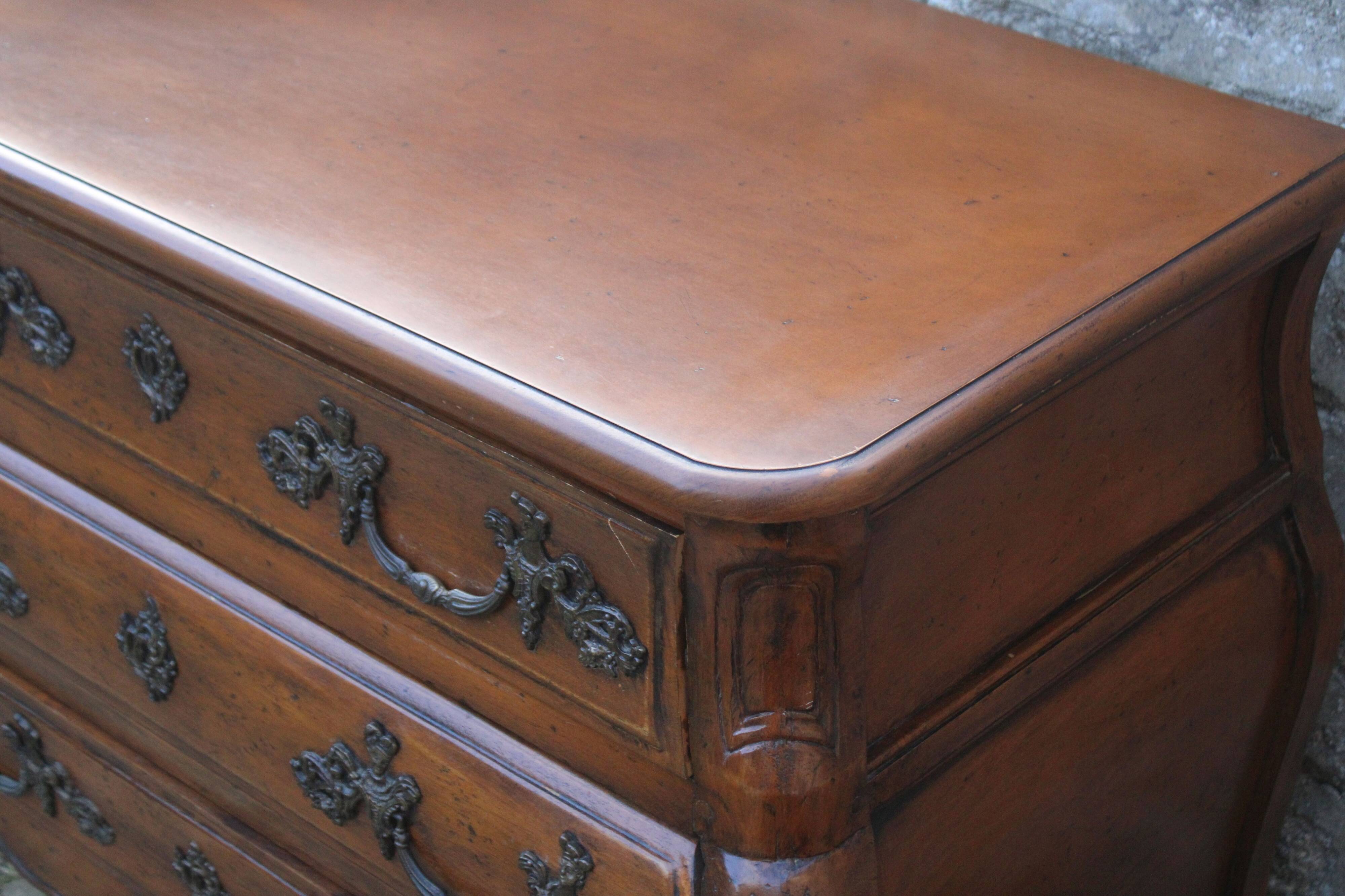 Curved Louis XV style chest of drawers known as a “tomb”