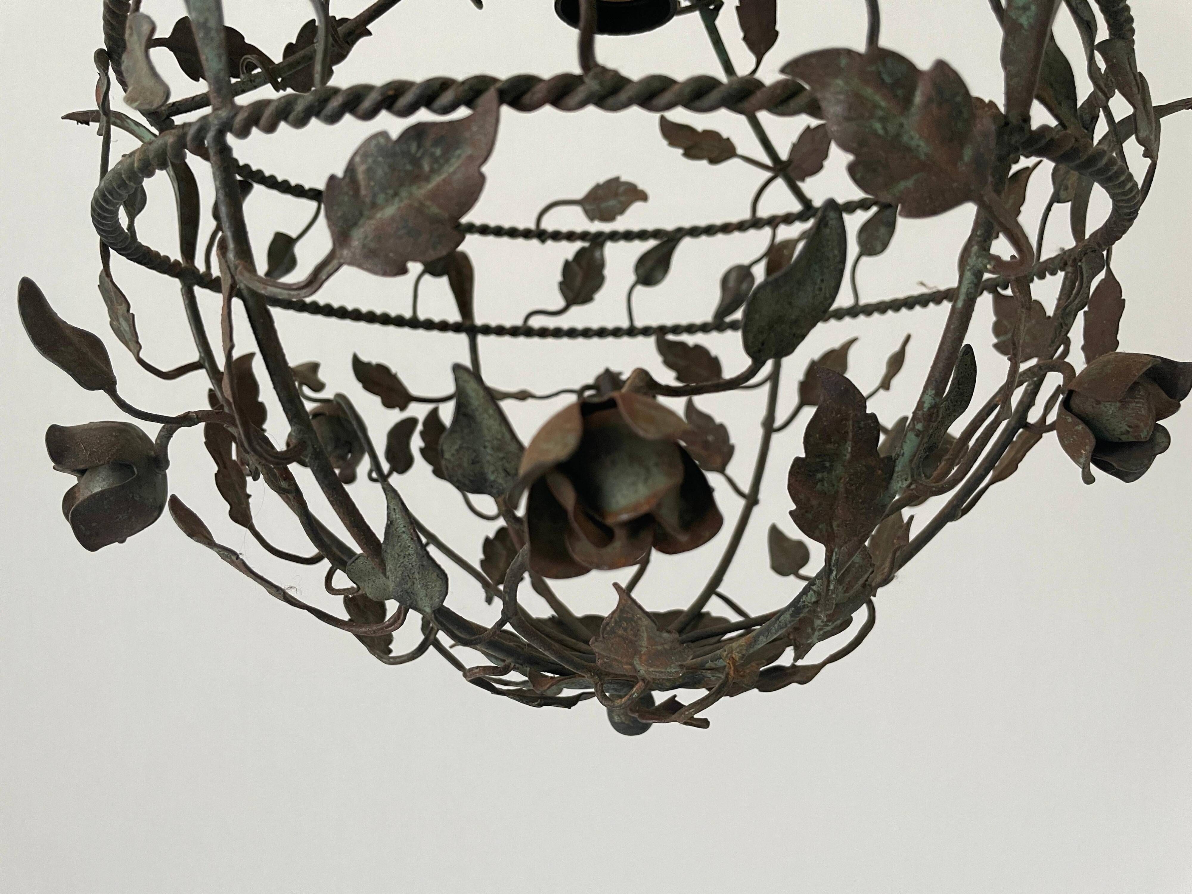 Patinated metal ceiling light with a floral and leaf pattern, 1950s, Italy.