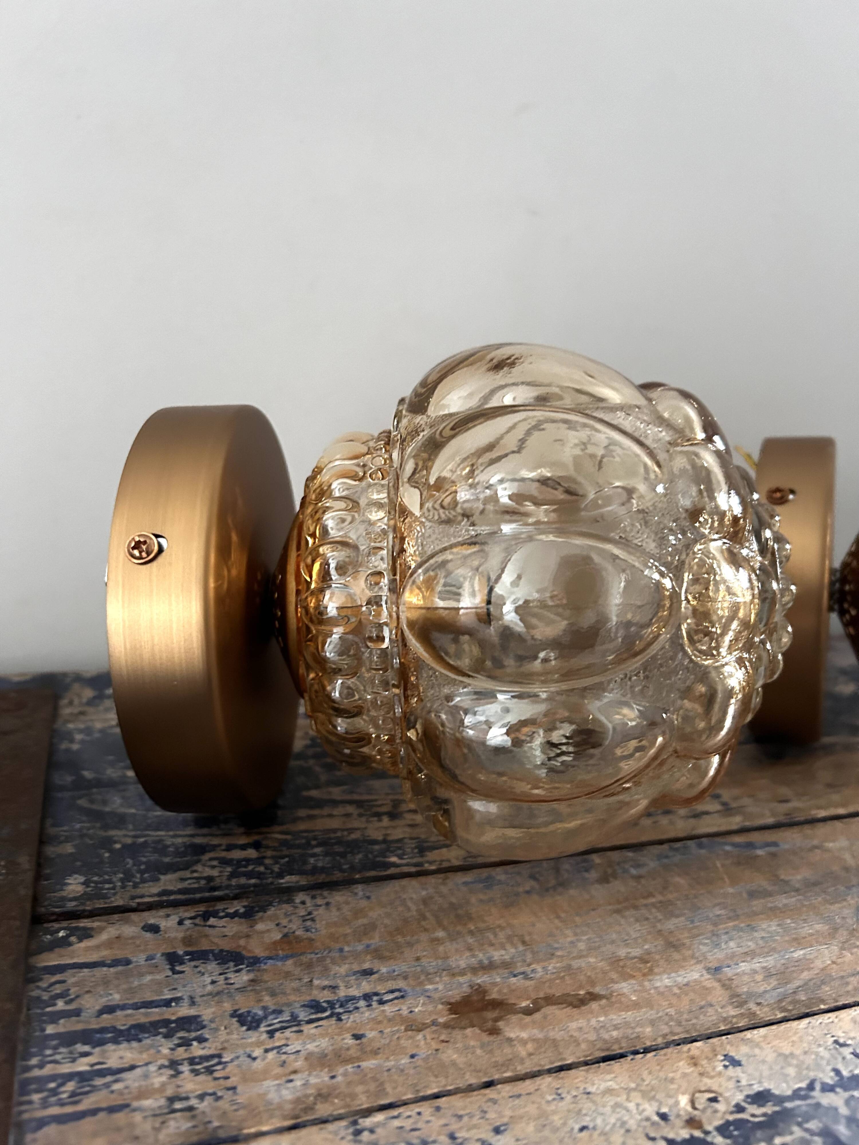Pair of Scandinavian golden globe wall lights