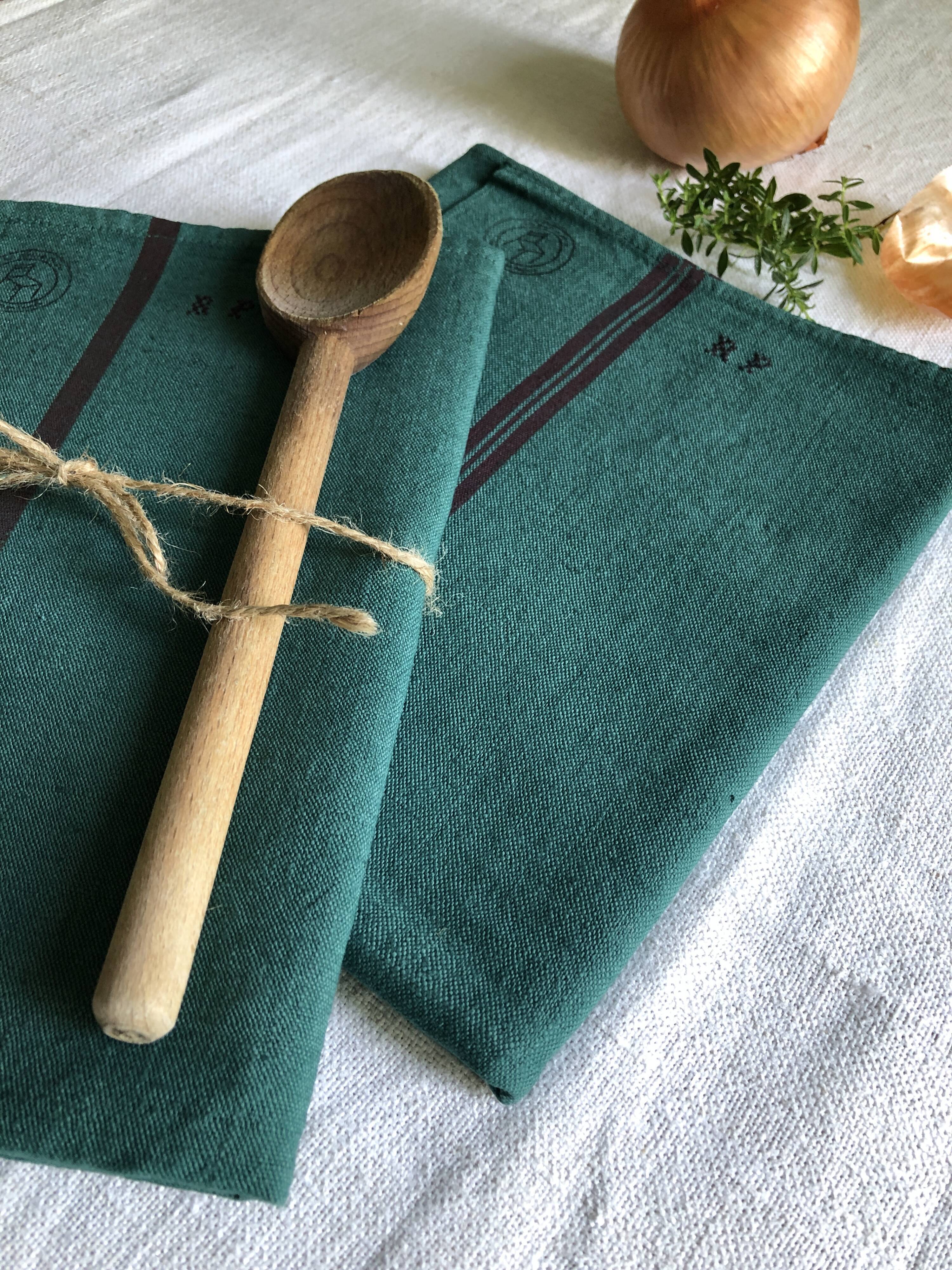 Old linen and cotton tea towel tinted in fir green