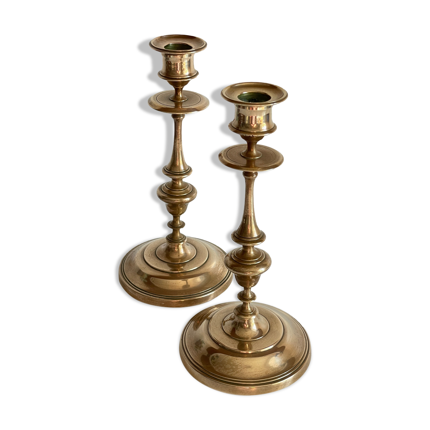 Pair of antique candle holders in solid brass
