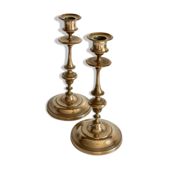Pair of antique candle holders in solid brass