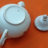 Old porcelain teapot with floral decoration