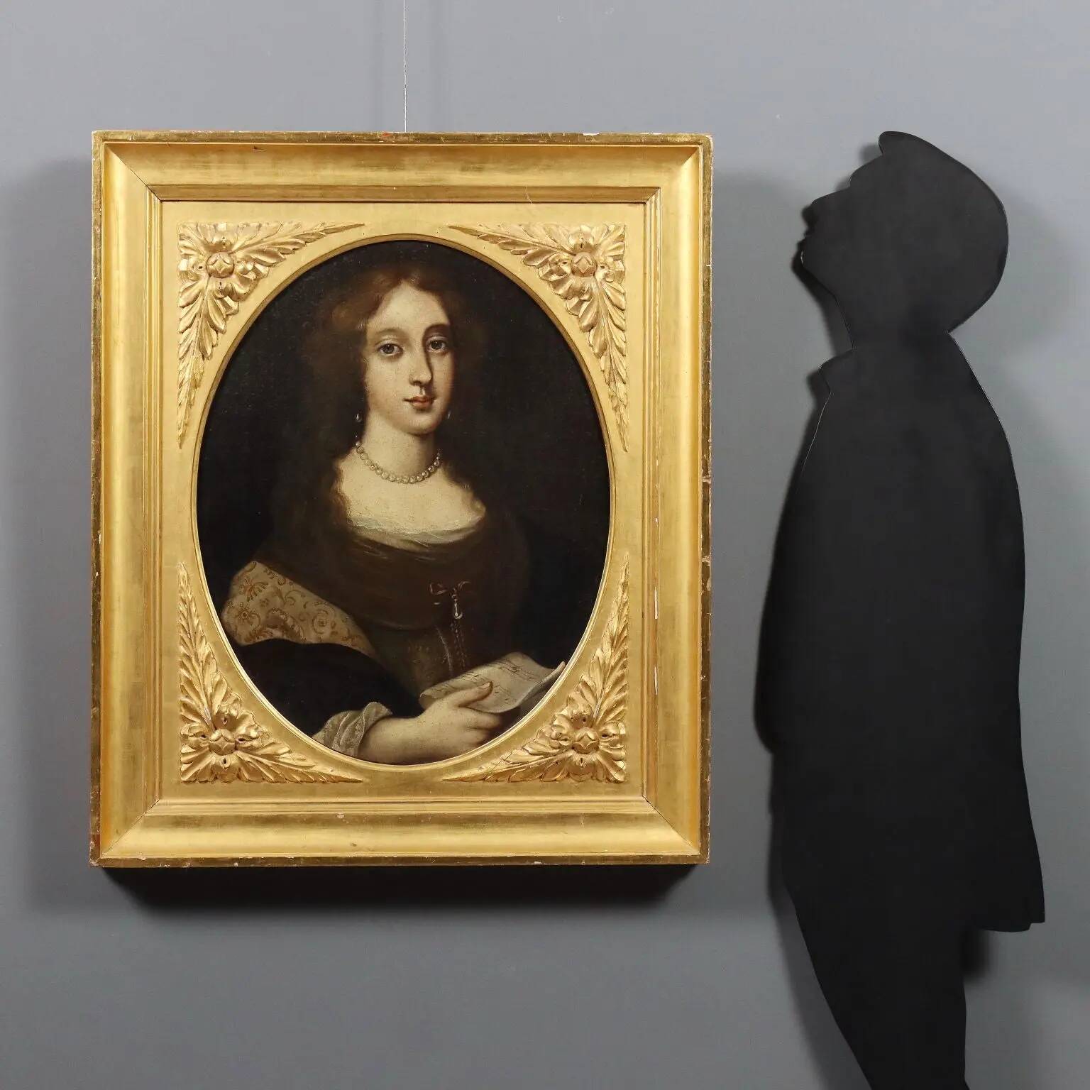 Ancient painting of a woman, oil on canvas, 17th century.