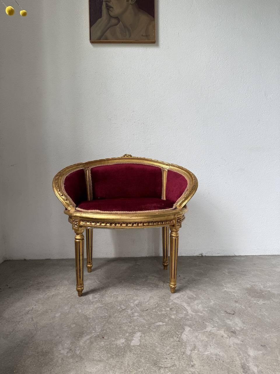 Louis XVI gilt wood and red velvet armchair