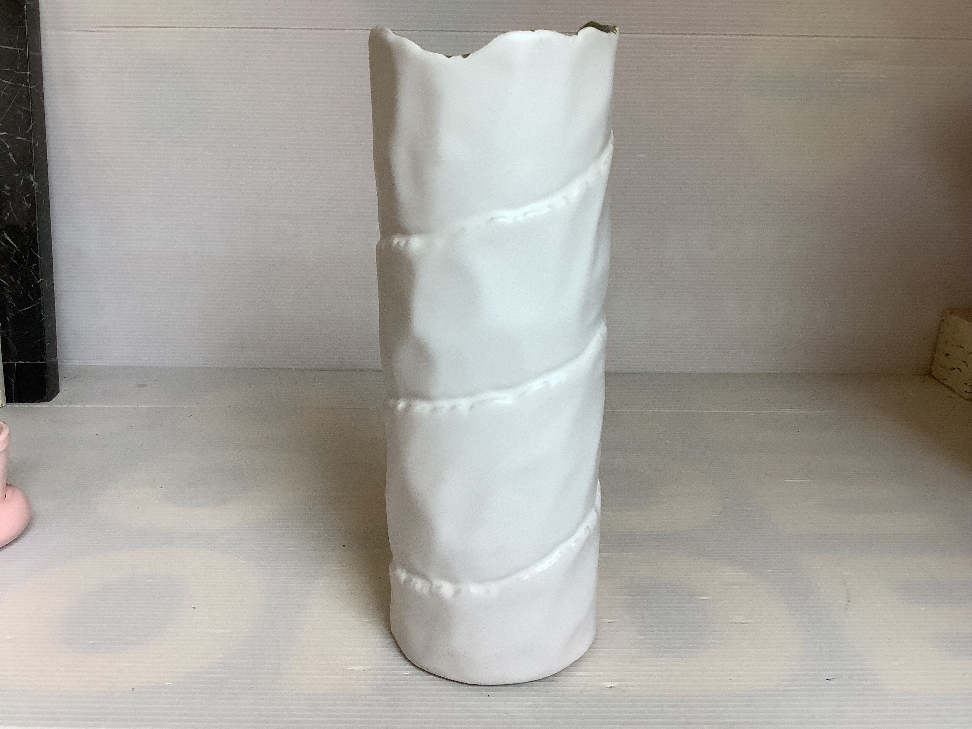 Vase with patterns of rolled paper leaves