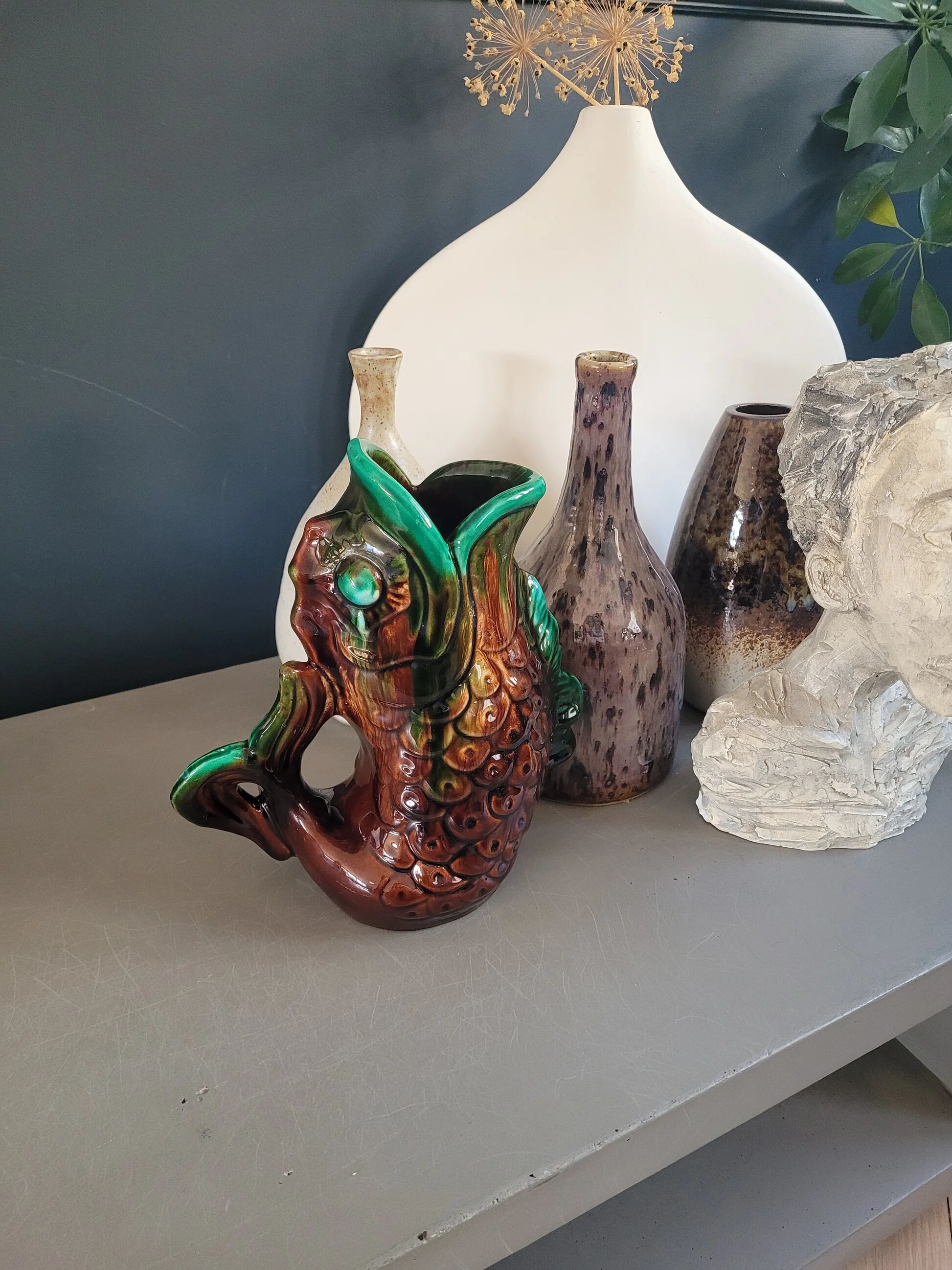 Old ceramic fish jug