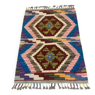 Afghan kilim rug in wool, pastel geometric patterns,