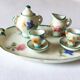 Small antique tea set in porcelain for children.