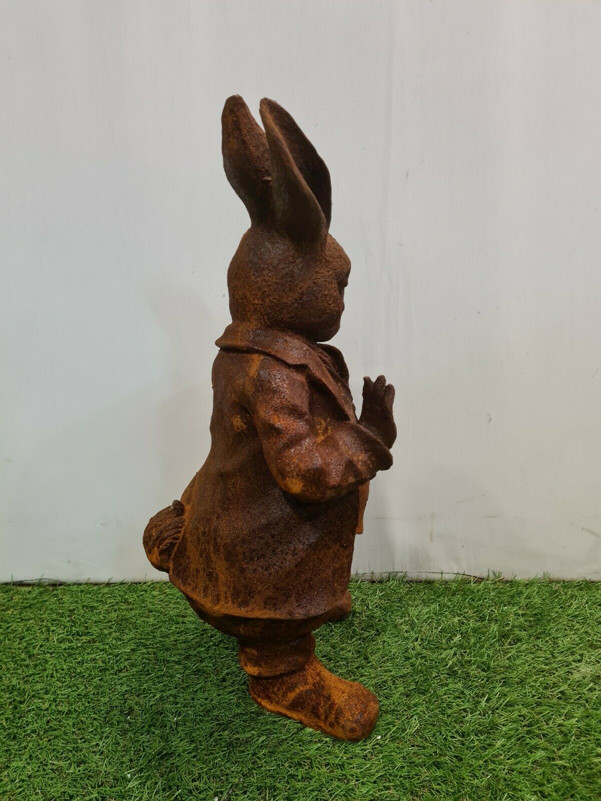 Rabbit with a cast iron pipe garden statue