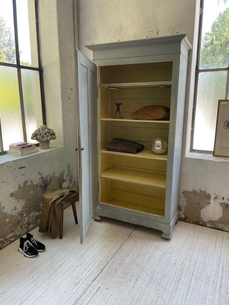 Blue patinated cap cabinet