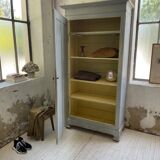 Blue patinated cap cabinet