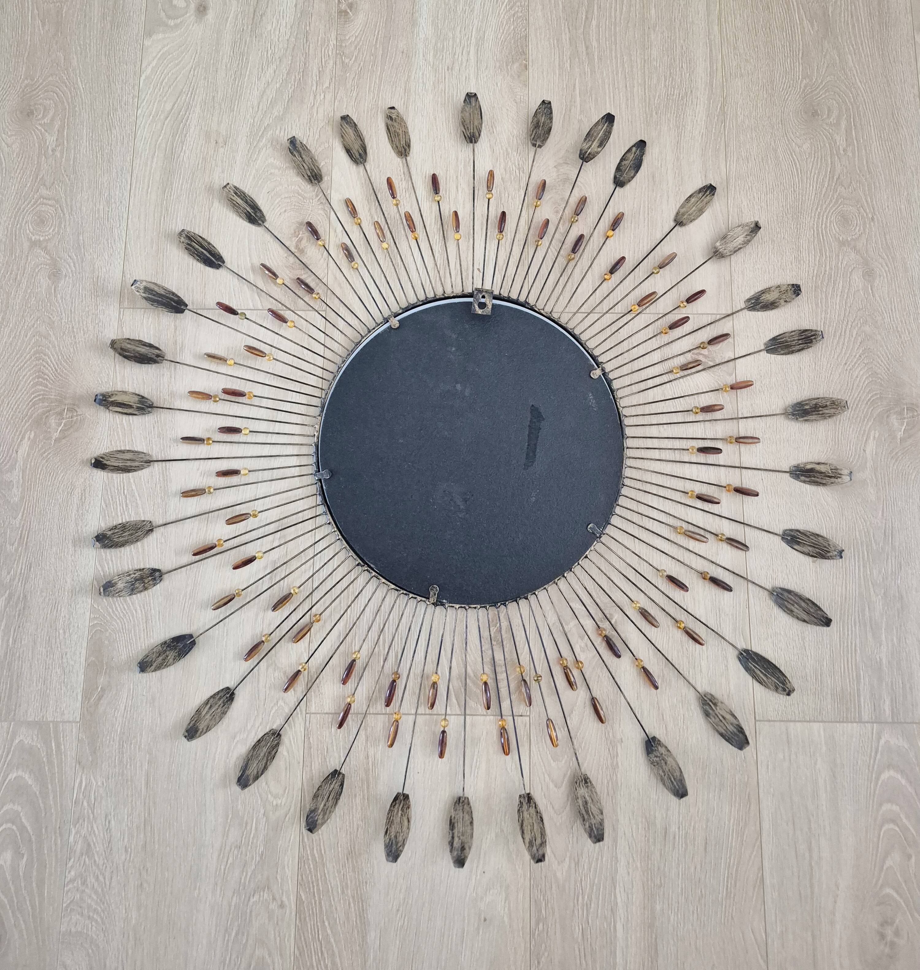 Vintage metal sun mirror in the style of Line Vautrin