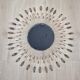 Vintage metal sun mirror in the style of Line Vautrin