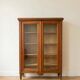Small antique wooden glass-fronted bookcase