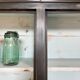 Display cabinet in patinated wood