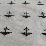 White and black carpet with berber patterns hand-woven in natural wool