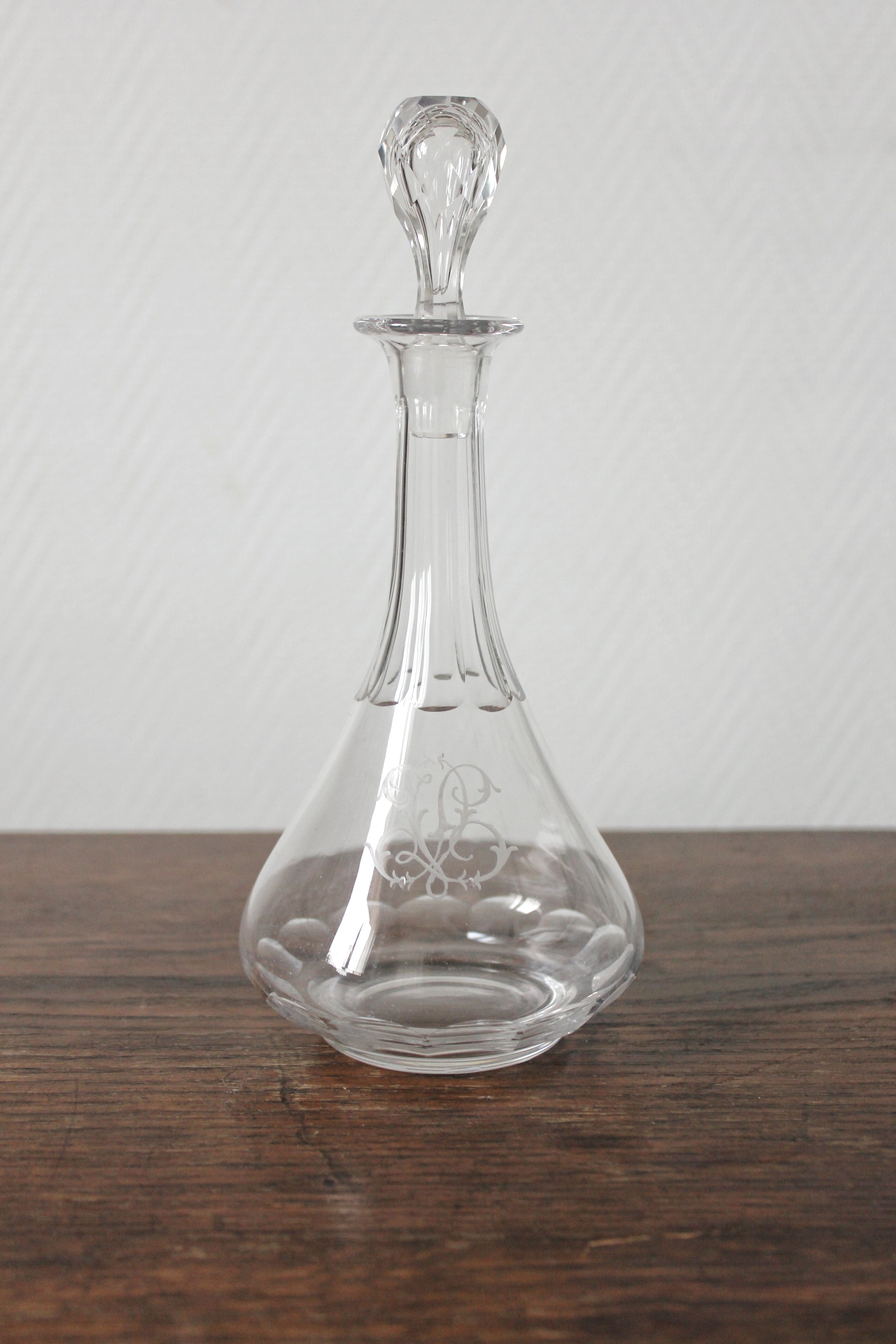 Antique crystal liqueur decanter with engraved monogram and flat ribs