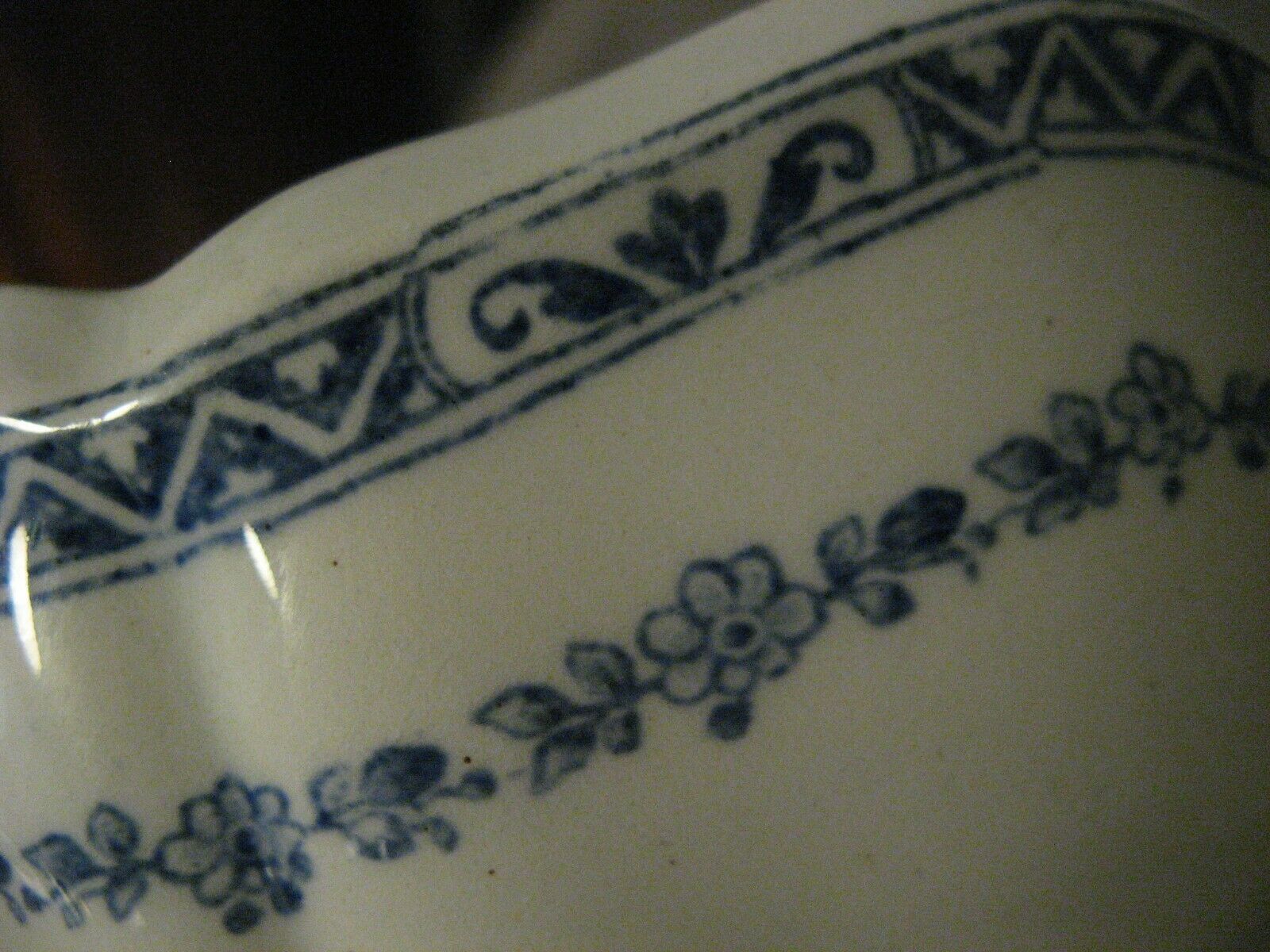 Saucière in Gien earthenware anse in the shape of a dolphin decoration garland 1900