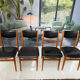 4 Scandinavian chairs in teak and black faux leather.
