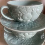 Set of 4 soup / consommé cups and saucers in ceramic.