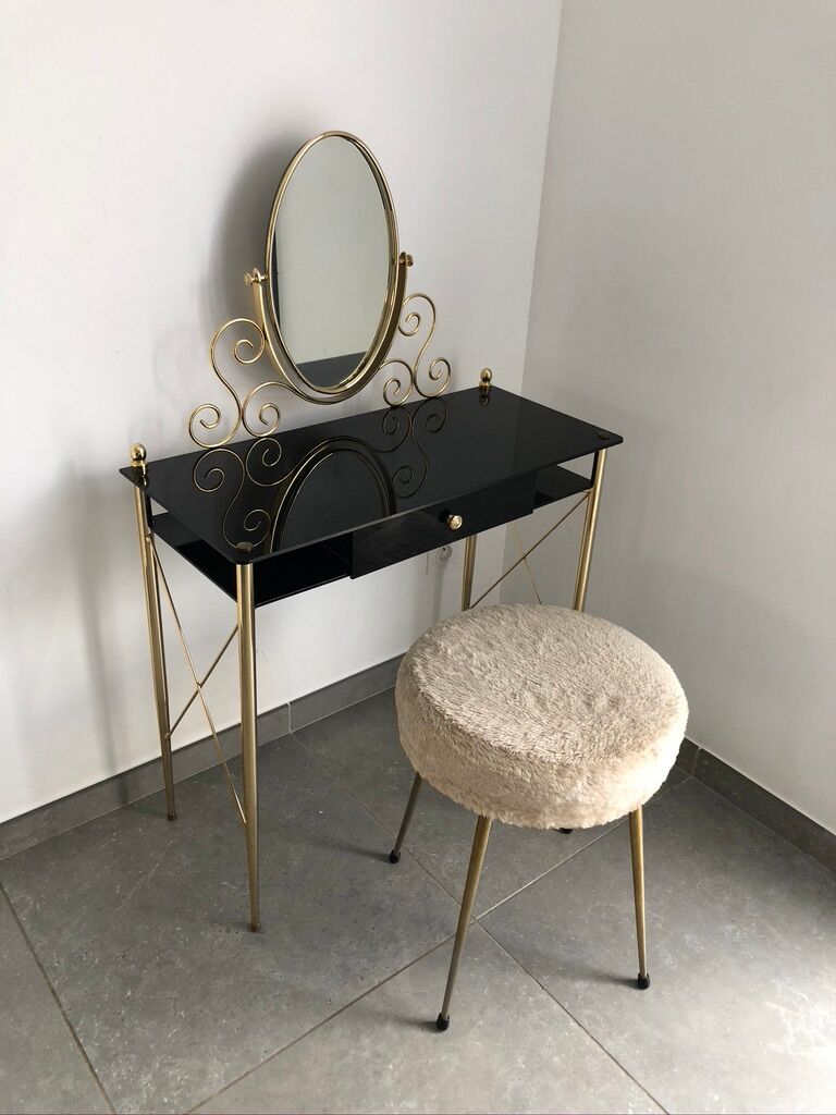 Brass hairdresser, glass and black plastic with its fluffy stool.