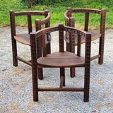 Set of three brutalist tripod armchairs in carved solid oak