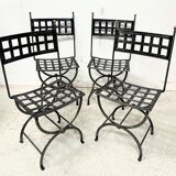 Set of four wrought iron chairs, with a reclining X-shaped base, seat and backrest.