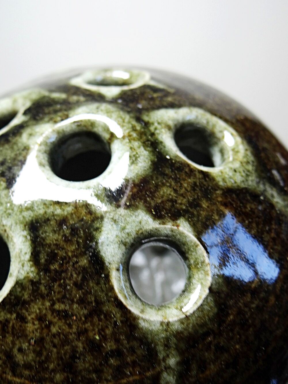 Brown and green glazed stoneware flower holder, vintage craftsmanship from the 1970s-1980s.