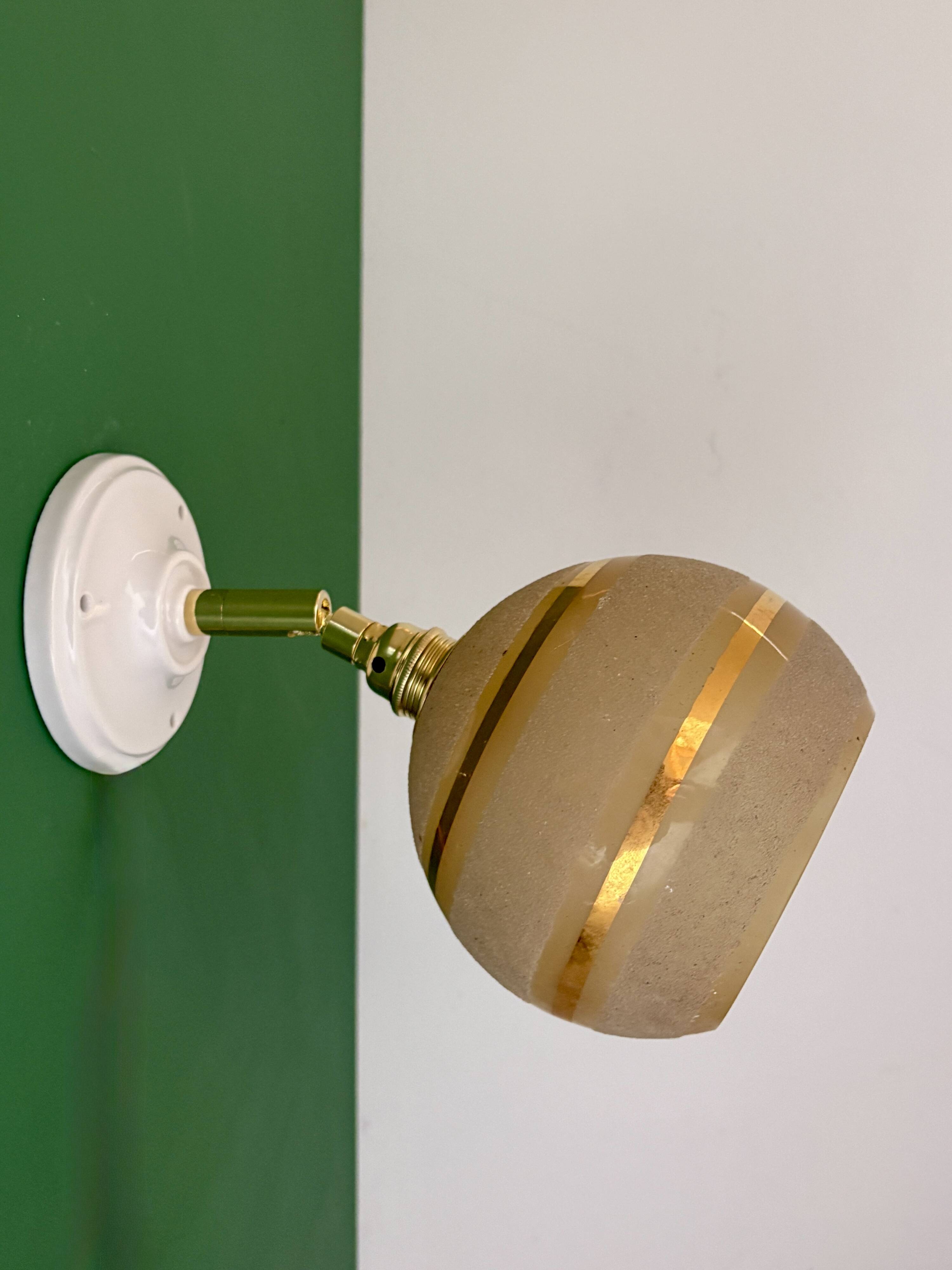 Vintage globe wall light in frosted yellow and gold glass.