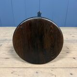 Unmarked black Rowac stool with a dark wood seat.