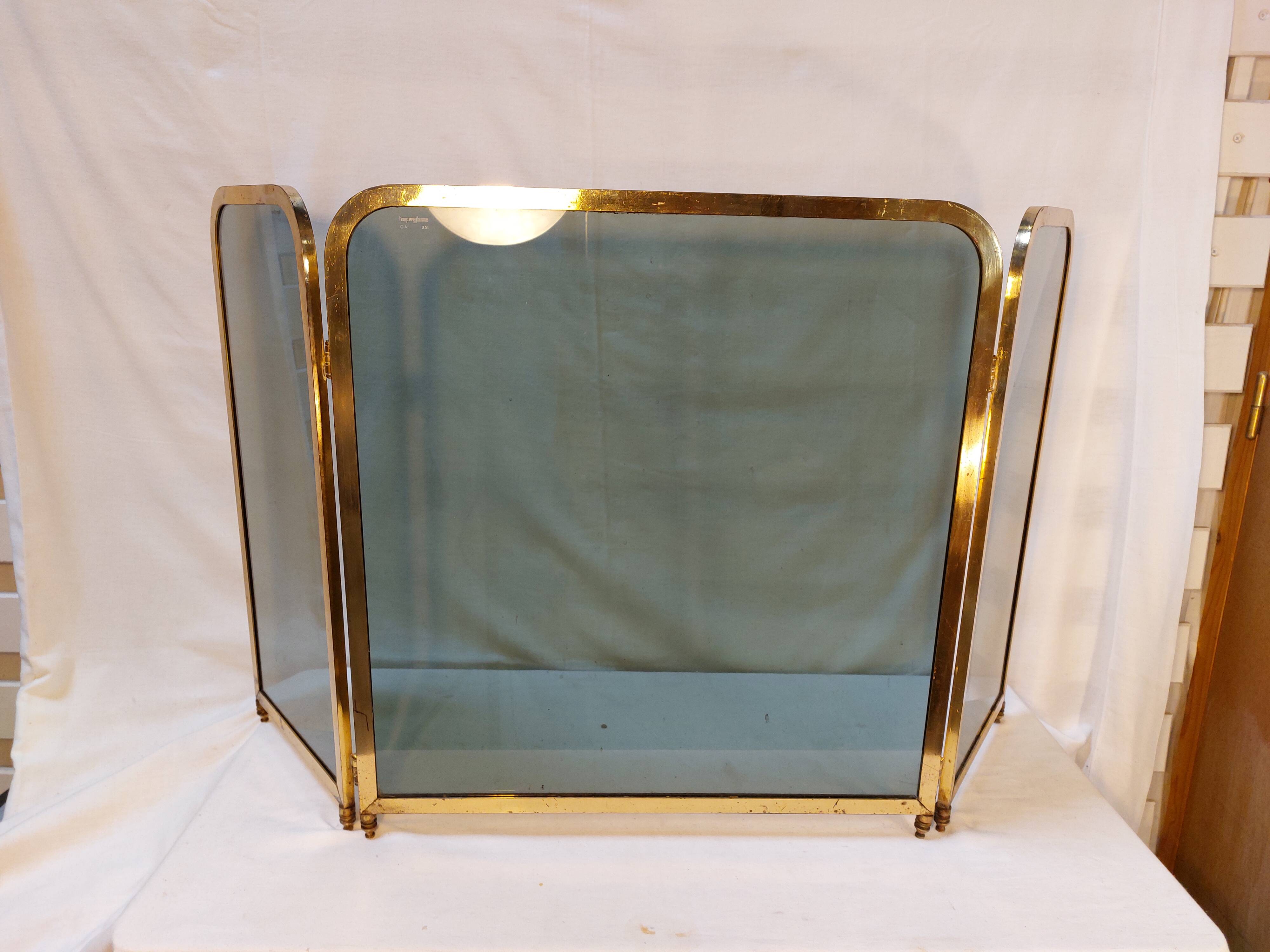 Vintage fireplace screen in smoked glass and gold-tone metal