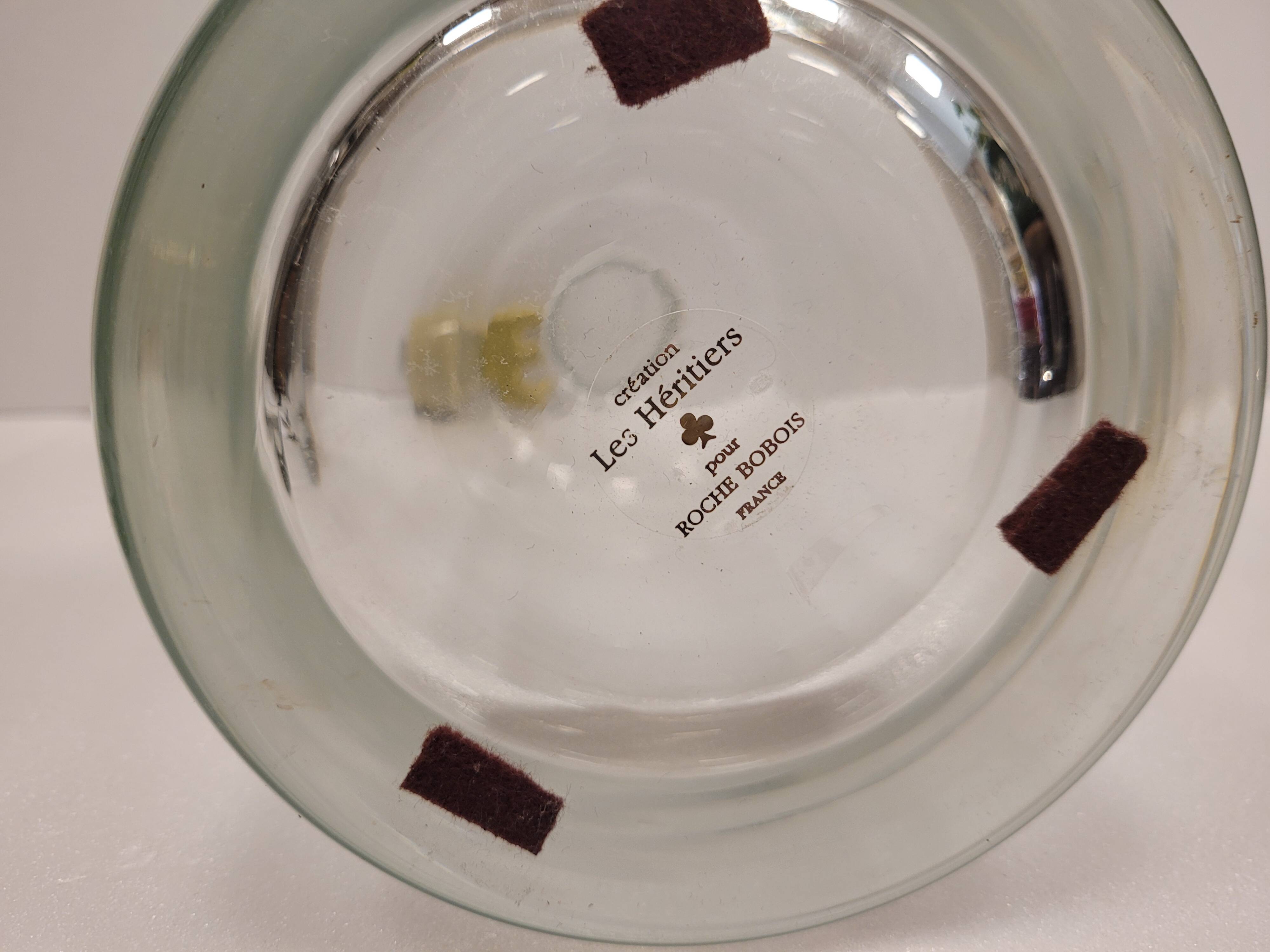 pair of decanters, bottles or jars, made in crystal with a ceramic tap enameled in green color