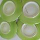4 hand-decorated earthenware plates with vegetable and green leaf designs.