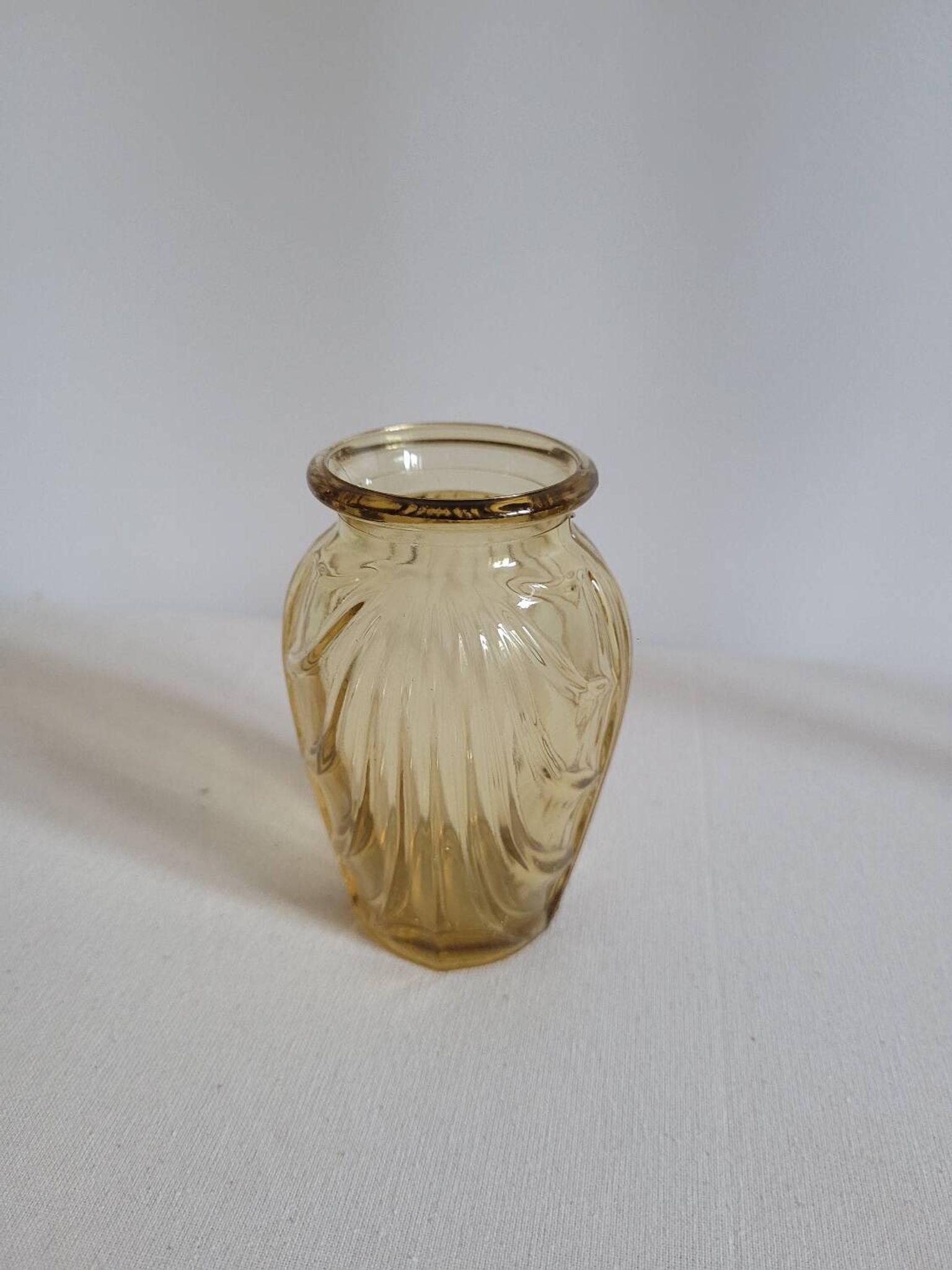 Small yellow draped bulb vase