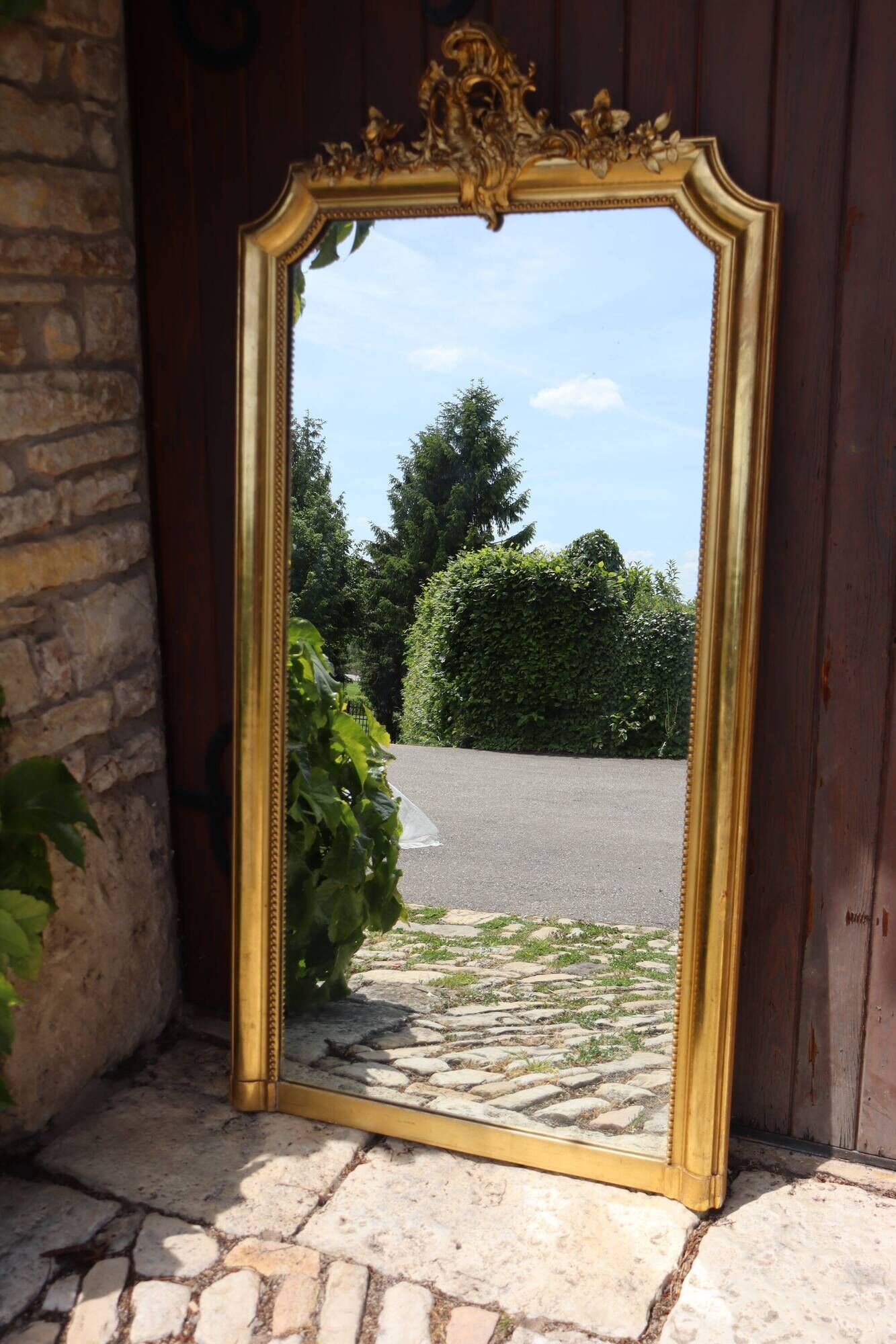 Large gold mirror in Louis XV style