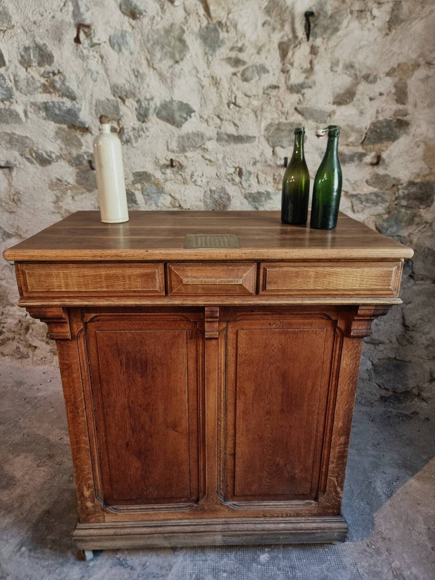 Antique French oak shop counter, kitchen island on wheels, circa 1880–1900.