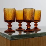 Lot of 4 vintage wine glasses from the 1970s, textured amber on a stem, design by Timo Sarpaneva for Iittala.