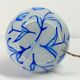 Antique table lamp in opaline glass with blue floral decoration.