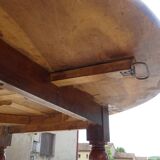Round drop-leaf table made entirely of solid walnut