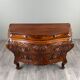 Curved commode in the Louis XV style, carved wood, 19th century.
