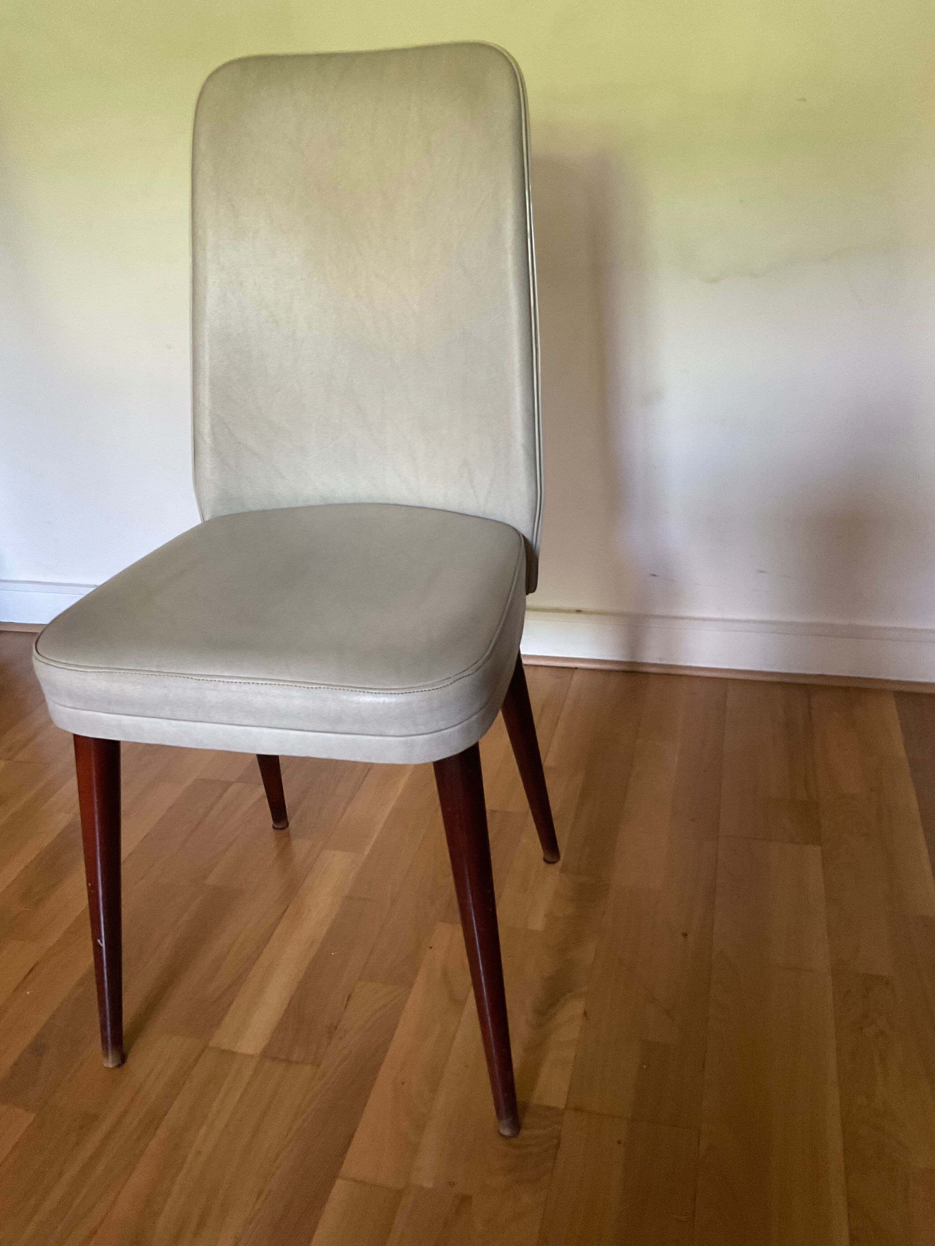 Pair of vintage mahogany and skai chairs