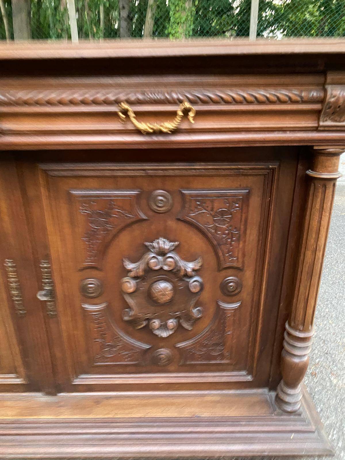 Henri II sideboard in carved wood, 1930.