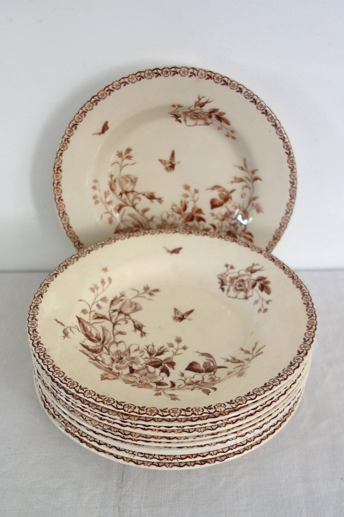 11 deep plates Terre De Fer Gien model Mai circa 1900