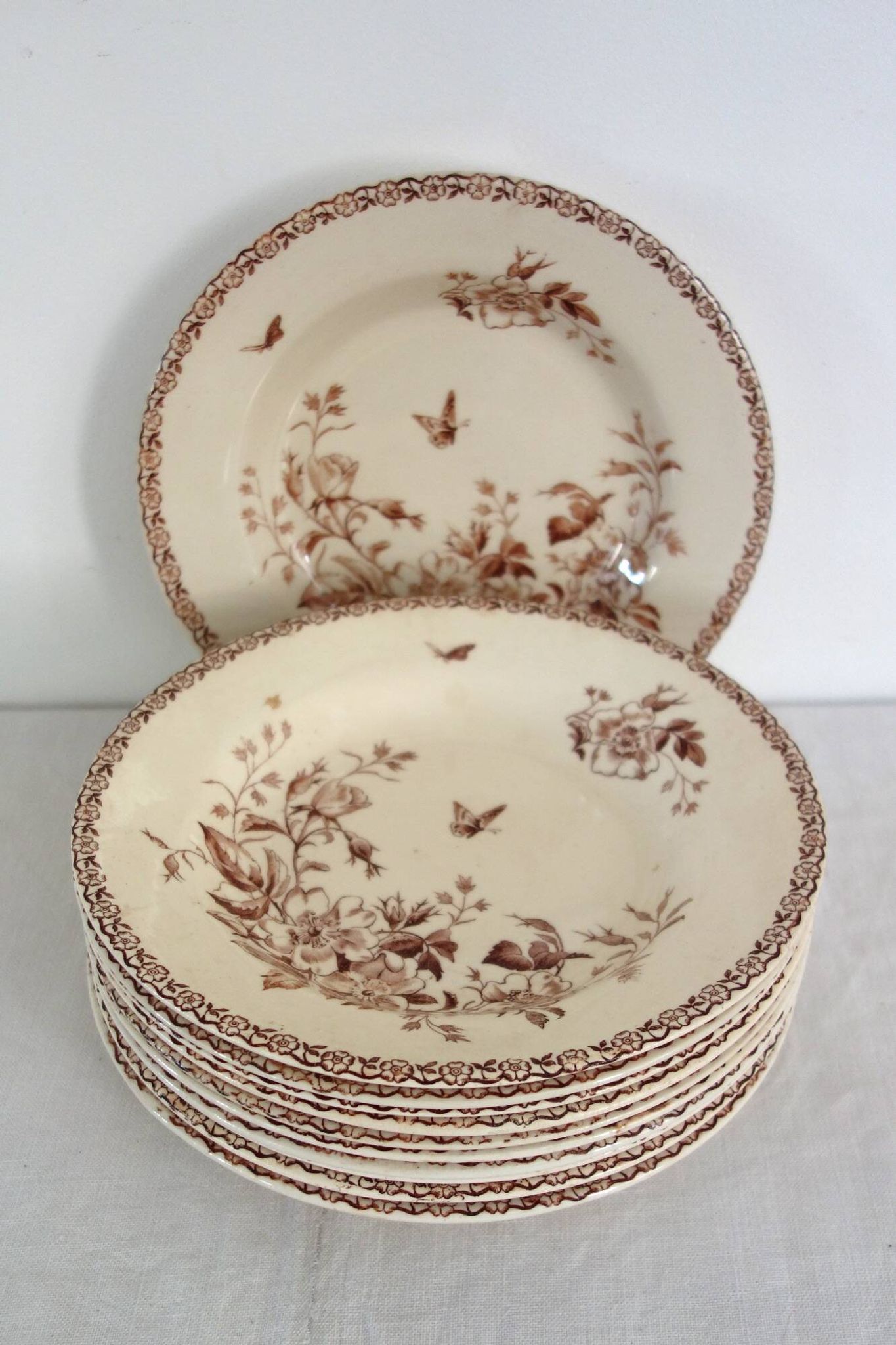 11 deep plates Terre De Fer Gien model Mai circa 1900