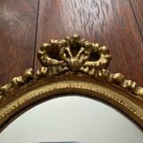 Oval wall mirror in baroque gilded plaster frame 29x20cm