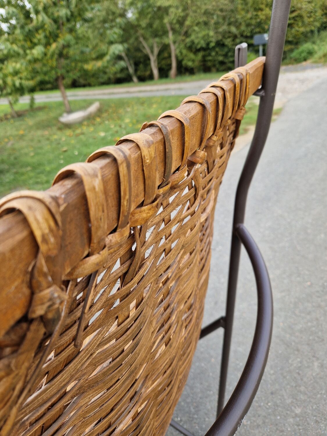 Large vintage metal and wicker armchair