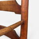 Antique rustic armchair in walnut and leather, 18th century.