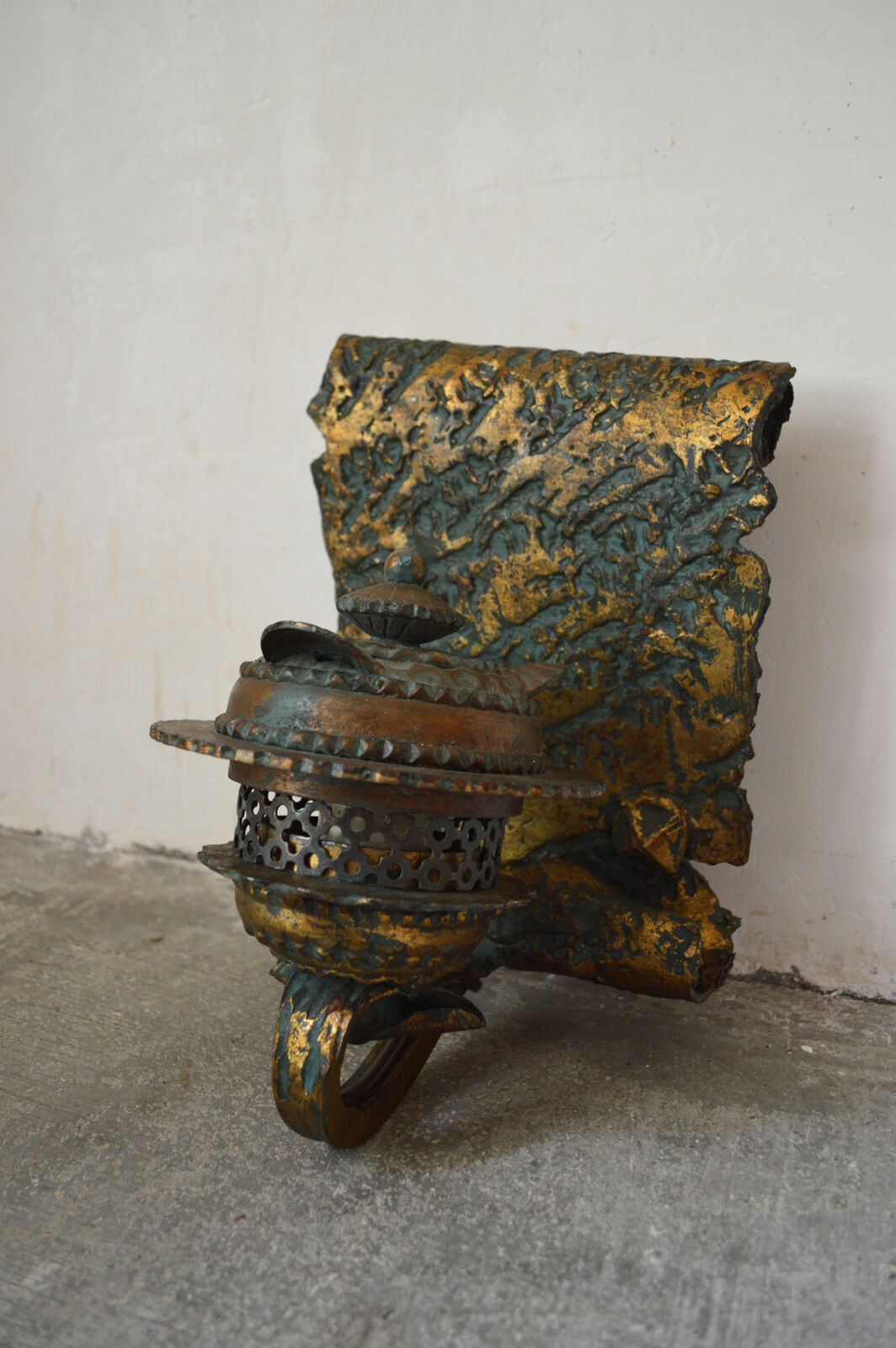 Pair of patinated wrought iron sconces