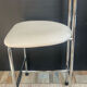 Vintage 70s chair in chrome metal and white faux leather.